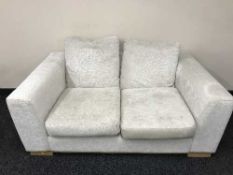 A three seater settee and two seater settee upholstered in beige fabric