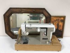 A cased New Home electric sewing machine,
