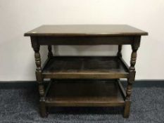 An oak three tier serving table