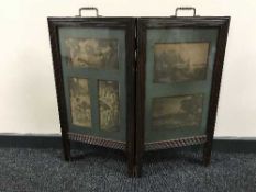 An Edwardian oak two-way folding fire screen inset with five black and white lithographic prints