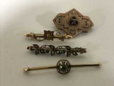 Four gold brooches, variously set with garnets, peridot, seed pearls etc, 9.