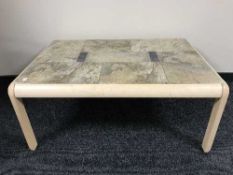 A Danish beech coffee table with travertine tiled top