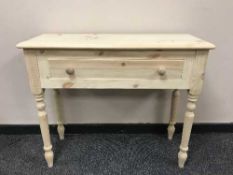 A pair of light pine side tables fitted with a drawer, width 91 cm.
