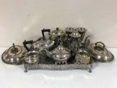 A large quantity of silver plate including twin handled gallery tray on paw feet,