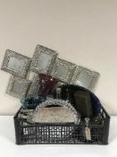 A basket of contemporary mosaic vases, tea light holders, blue glass vase, mirrored stand,