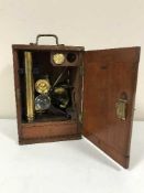 A brass microscope by T & H Double of London in a fitted mahogany box