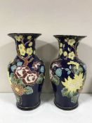 A pair of blue floral glazed Oriental style vases
