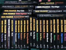 A box containing a collection of thirty-five Dick Francis horse racing novels