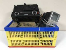 A crate containing a Yelco projector, equipment, camcorder,