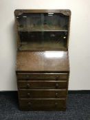 A 1930's oak bureau bookcase