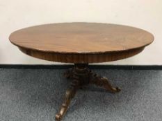 A carved mahogany Victorian breakfast table, width 138 cm.