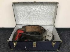 A mid 20th century trunk containing shire horse collar and tack