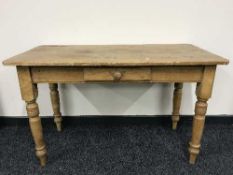 An antique pine kitchen table fitted a drawer