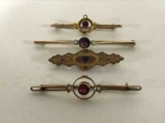 Four gold stone set brooches, 8.