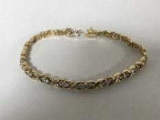 An 18ct gold diamond set bracelet, approximately 0.