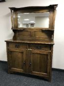 An Edwardian oak mirror back sideboard