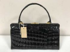 A Black patent crocodile skin handbag