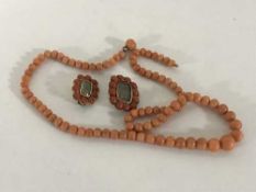 A coral bead necklace,