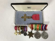 A WWII OBE medal group with ribbons, to include Africa Star, Defence Medal and War Medal and OBE,