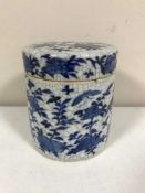 A Chinese blue and white crackle glaze lidded pot with bird and flower decoration,