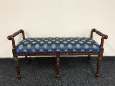 A reproduction Victorian style duet stool