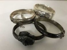 Five silver bangles