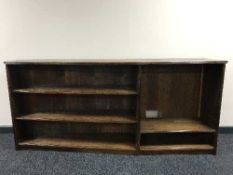 A shaped oak open bookshelf