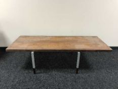 A late 20th century rose wood coffee table on chrome legs