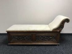 A late Victorian carved oak storage chaise longue