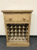 A reclaimed bottle rack fitted with a drawer,
