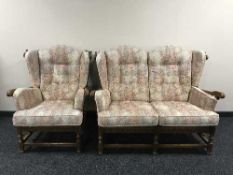 An Ercol two seater wing backed settee with matching armchair