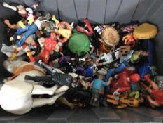 A box of a large quantity of action figures, wrestling figures,