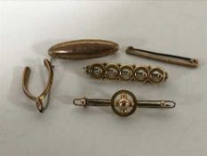 Five assorted gold brooches, 8.