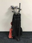 A golf bag containing assorted irons and drivers by Lynx, Hippo etc,