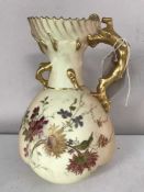 A pair of Royal Worcester blush ivory and gilded jugs,