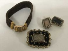 A group of early 19th century memoriam jewellery including a hair bracelet with high carat gold