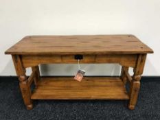 A Java craftsman pine two tier hall table fitted a drawer