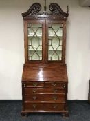 A Victorian style bureau bookcase