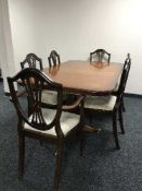 A Regency style twin pedestal dining table and six chairs