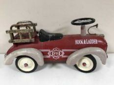 A late 19th century child's hook and ladder fire department tin plate car