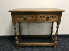 An oak hall table fitted two drawers