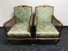A pair of walnut framed bergere armchairs