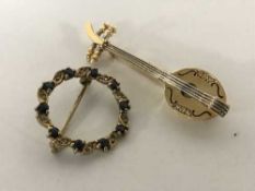 Two 18ct gold brooches set with diamonds and sapphires,