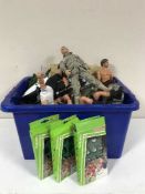 A box containing action men, building bricks,