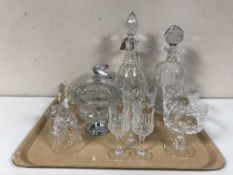 A tray of two lead crystal decanters, pair of glass vases, drinking glasses,