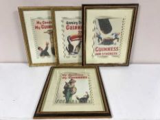 A set of four framed Guinness prints