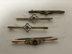 Four gold brooches, variously set with seed pearls, amethyst, aquamarine etc, 8.
