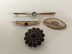 Four gold brooches including a large garnet cluster, 10.