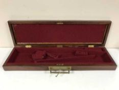 A mahogany and brass mounted gun case with two keys