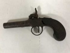 An antique percussion cap pistol